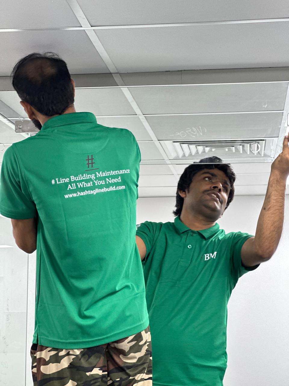 Glass panel installation in office ceiling area